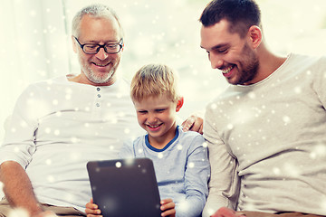 Image showing smiling family with tablet pc at home