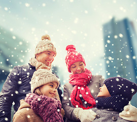 Image showing happy family in winter clothes outdoors