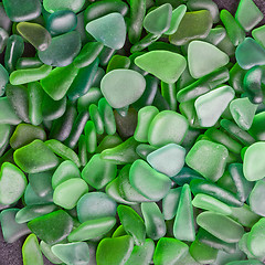 Image showing green pieces of glass polished by the sea