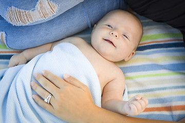 Image showing Little Baby Boy Wrapped In His Blanket Resting With Mommy