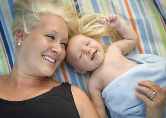 Image showing Little Baby Boy Wrapped In His Blanket Resting With Mommy