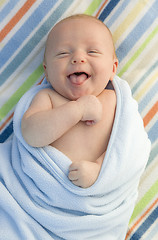 Image showing Laughing Baby Boy Wrapped in His Blanket