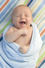 Image showing Laughing Baby Boy Wrapped in His Blanket