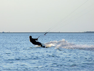 Image showing Silhouette of a kite-surf on waves of a gulf 2
