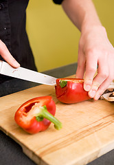 Image showing Female Slicing a Red Pepper