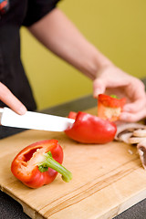 Image showing Female Slicing a Red Pepper