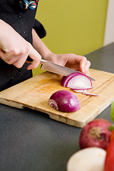 Image showing Woman Cutting an Onion