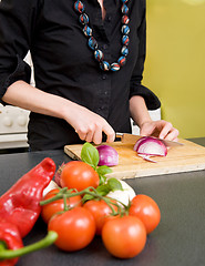 Image showing Woman Cutting an Onion