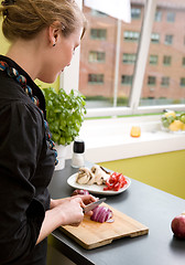 Image showing Woman Slicing a Red Onion