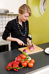 Image showing Woman Slicing a Red Onion