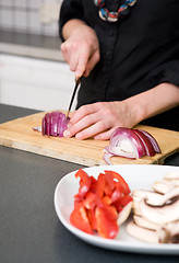 Image showing Woman Slicing a Red Onion