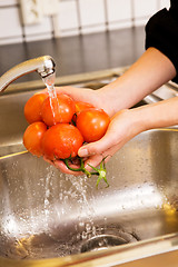 Image showing Washing Tomatoes