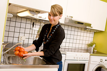 Image showing Female Washing Tomatoes