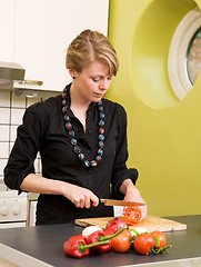 Image showing Woman Cutting Tomatoes