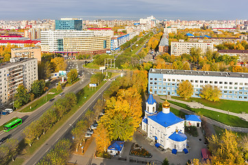 Image showing Church and office buildings on road inrtersection