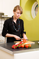 Image showing Female Cutting Tomatoes