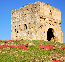 Image showing old castle in africa morocco and red leather near the tower