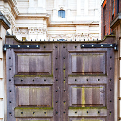 Image showing brown wooden parliament in london old  door and marble antique  