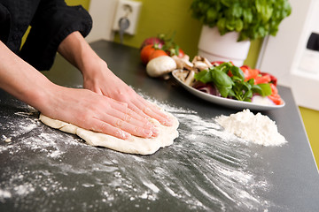 Image showing Hands making pizza - detail