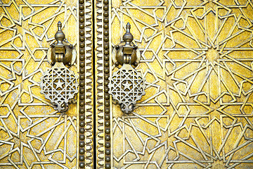 Image showing     morocco in gold star wood  facade home and safe padlock 