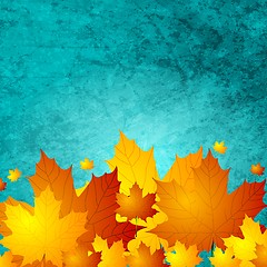 Image showing Autumn maple leaves on turquoise grunge wall texture