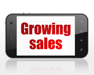 Image showing Finance concept: Smartphone with Growing Sales on display