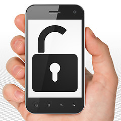 Image showing Privacy concept: Hand Holding Smartphone with Opened Padlock on display