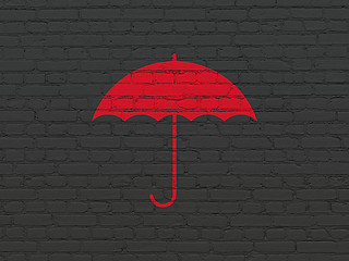 Image showing Security concept: Umbrella on wall background