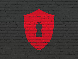 Image showing Protection concept: Shield With Keyhole on wall background