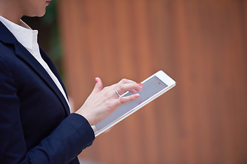 Image showing business woman working on tablet