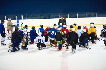 Image showing ice hockey players team meeting with trainer