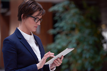 Image showing business woman working on tablet