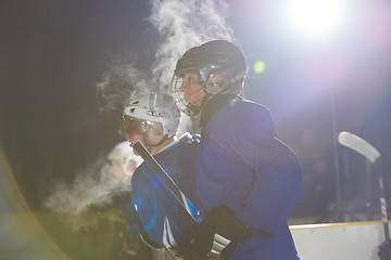 Image showing ice hockey players on bench