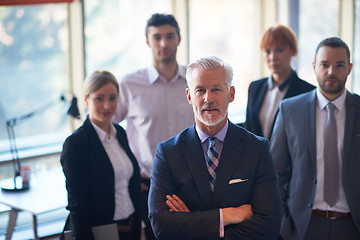 Image showing senior business man with his team at office