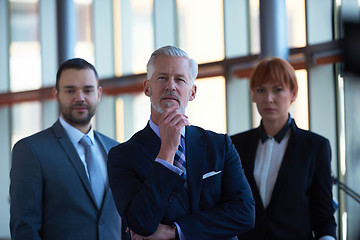 Image showing senior business man with his team at office