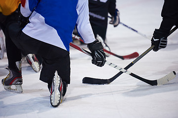 Image showing ice hockey players team meeting with trainer