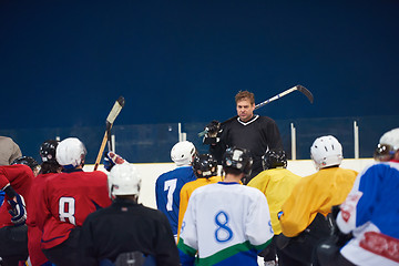 Image showing ice hockey players team meeting with trainer