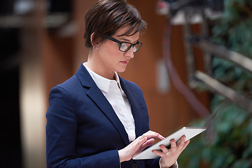 Image showing business woman working on tablet