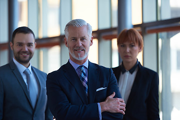 Image showing senior business man with his team at office