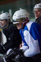 Image showing ice hockey players on bench