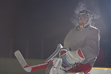 Image showing ice hockey players on bench