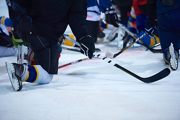 Image showing ice hockey players team meeting with trainer