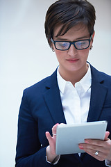 Image showing business woman working on tablet