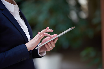 Image showing business woman working on tablet