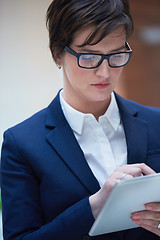 Image showing business woman working on tablet