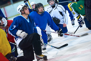 Image showing ice hockey players team meeting with trainer