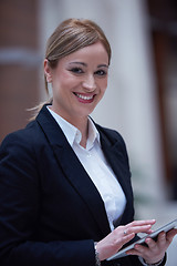 Image showing business woman working on tablet