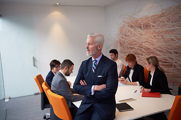 Image showing senior business man with his team at office