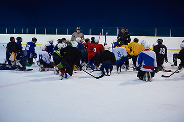 Image showing ice hockey players team meeting with trainer