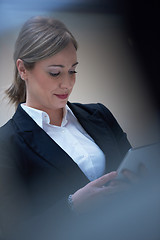 Image showing business woman working on tablet